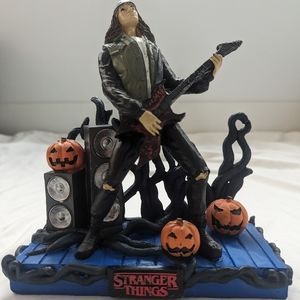 Eddie Munson playing guitar